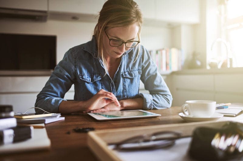 young professional writing a document sitting at desk